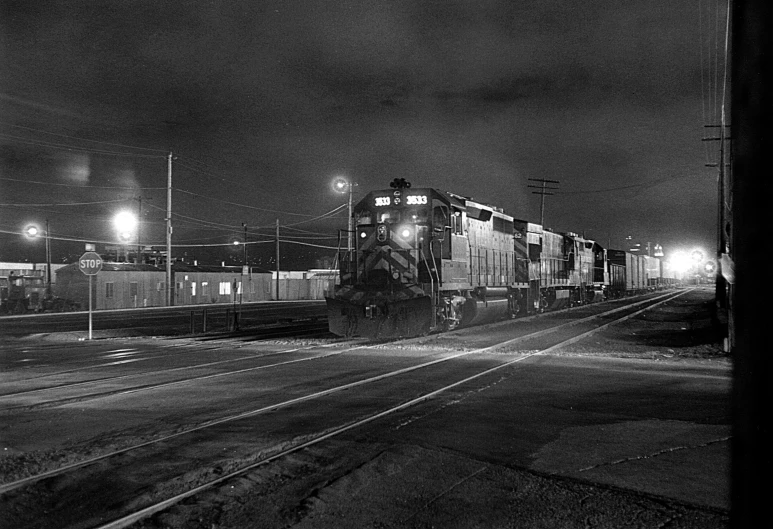 an old train is stopped in the evening at night