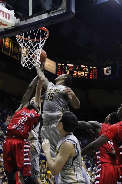 a game of basketball is being played on a court