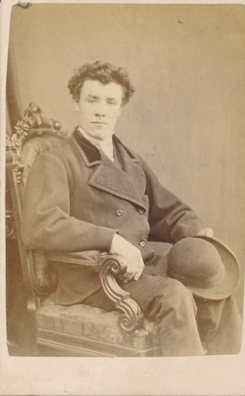 vintage pograph of a man sitting on a chair