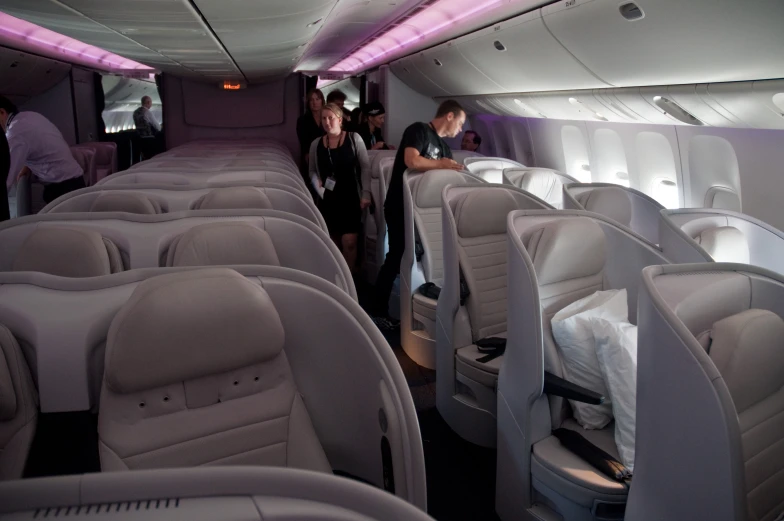 passengers in the inside of an airplane on an airplane