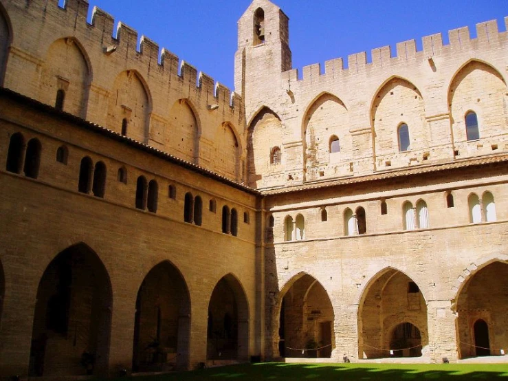 the courtyard and clock tower of the medieval building