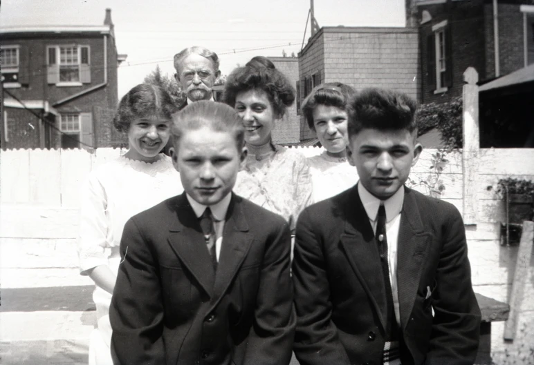 a group of people in suits standing next to each other