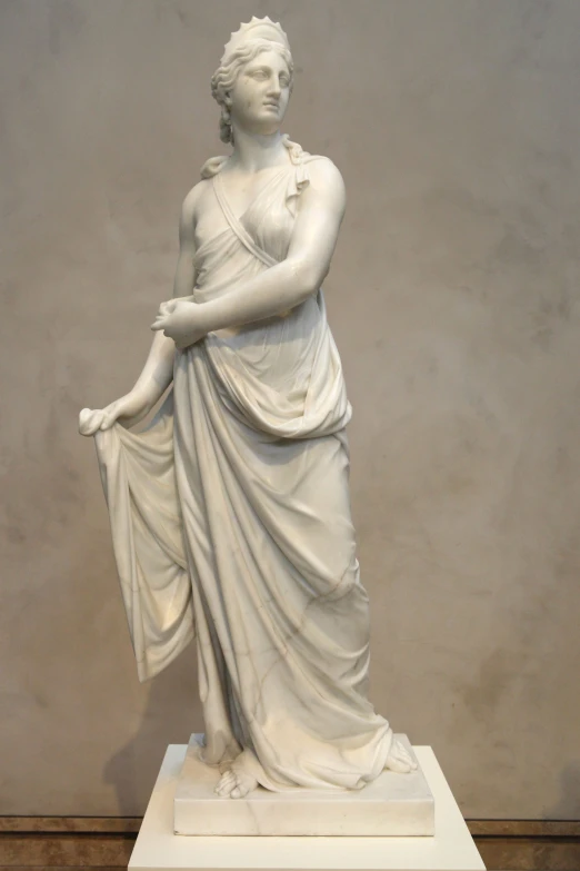 this statue is a female in an oriental dress