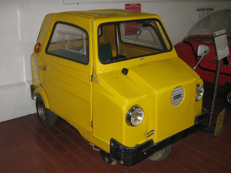 this small car is parked in the garage
