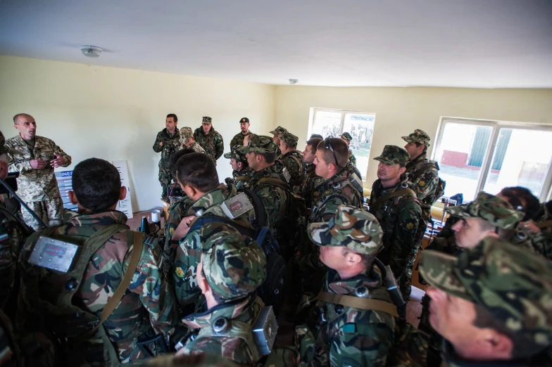 a group of military soldiers stand together