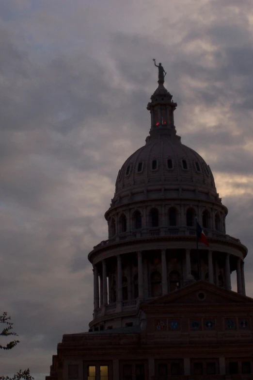 the dome of a building is lit up with the sun