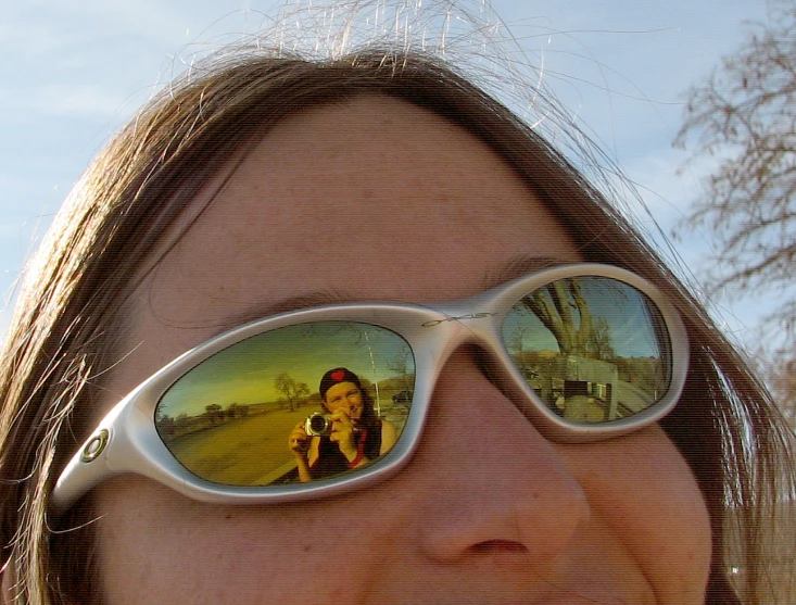 this lady has some pictures in her sunglasses