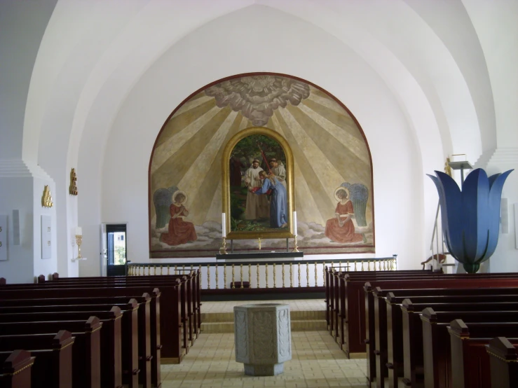 a small church with painted artwork on the walls