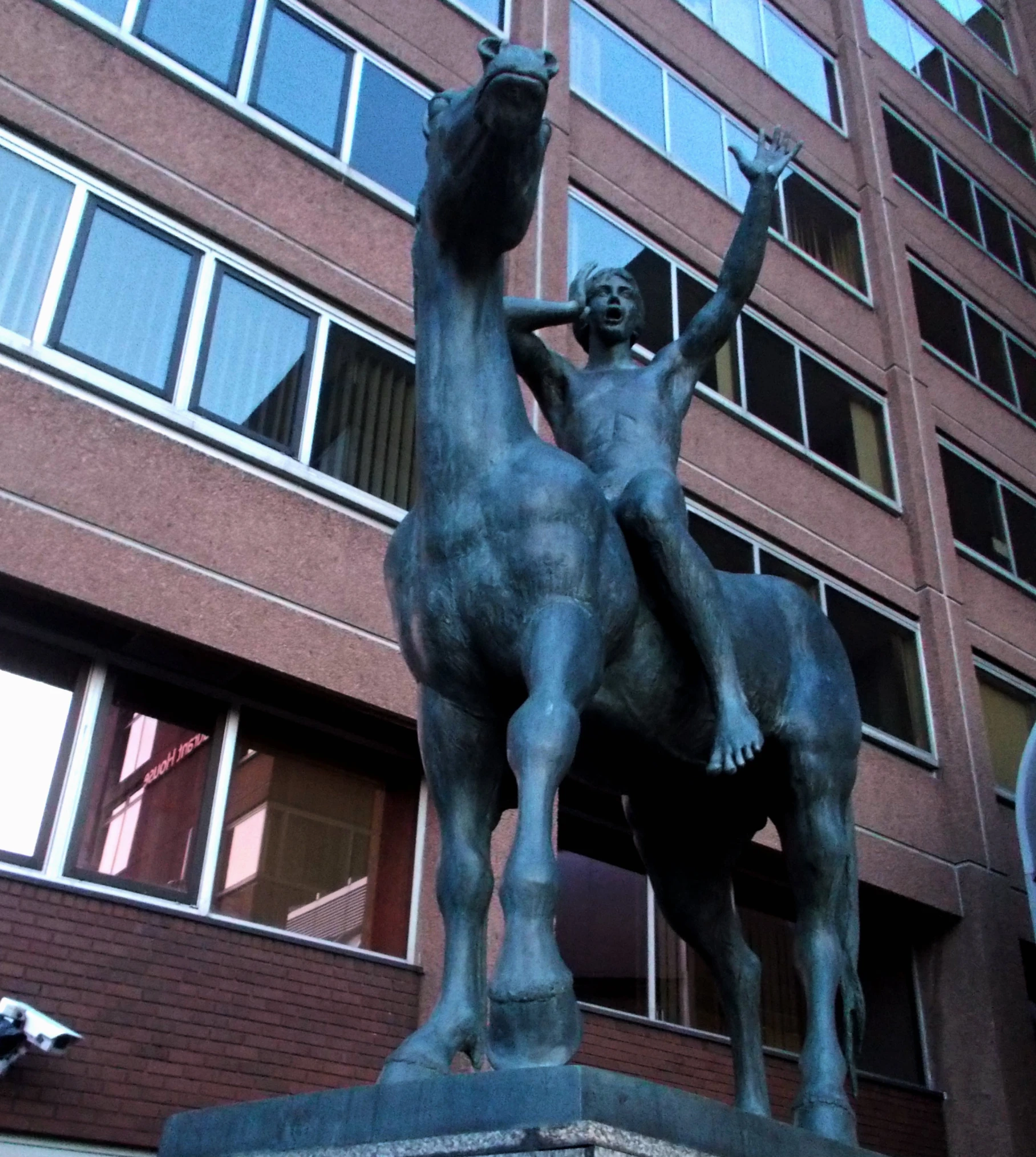 a statue of a man riding on the back of a horse