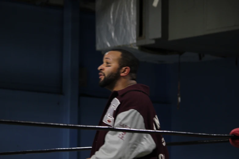 a man standing on a wrestling ring