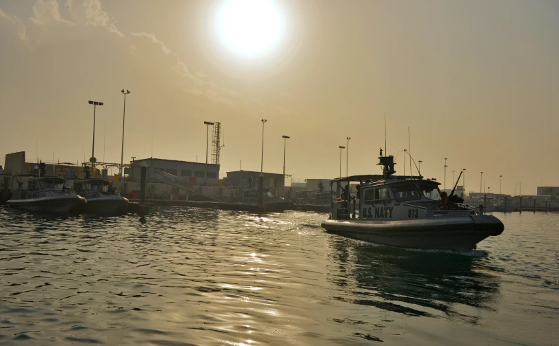 a harbor with boats anchored at it and some building