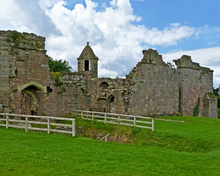 an old ruin building has two towers on one