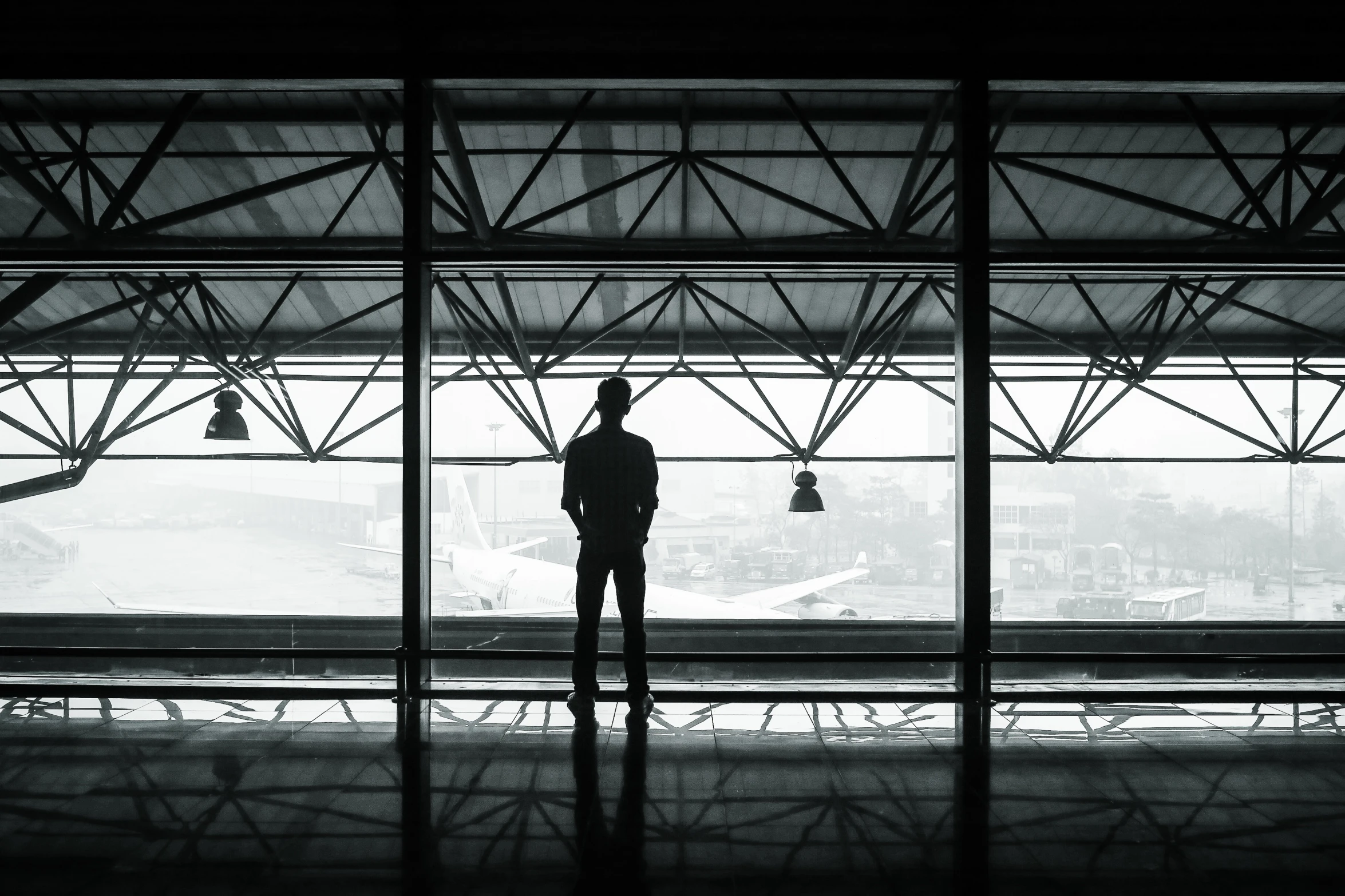 a person is standing near the train tracks