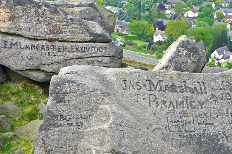 many granite rocks with hand written names on them