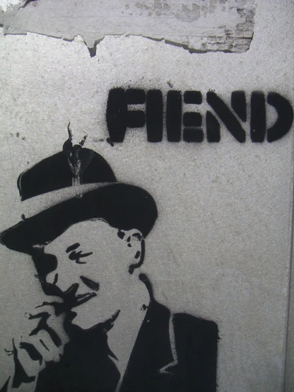 there is a stencil image of a man smoking