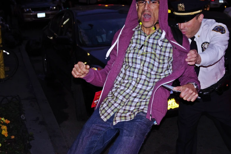 a man on skateboard in front of a cop