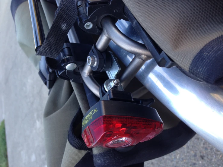 a close up of a motorcycle with its bike light on