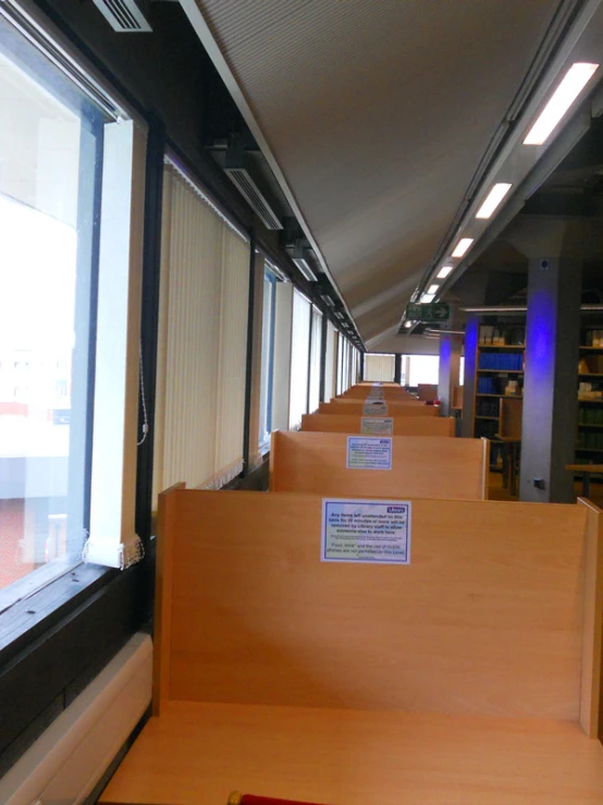 the long, narrow room has bookshelves near each other