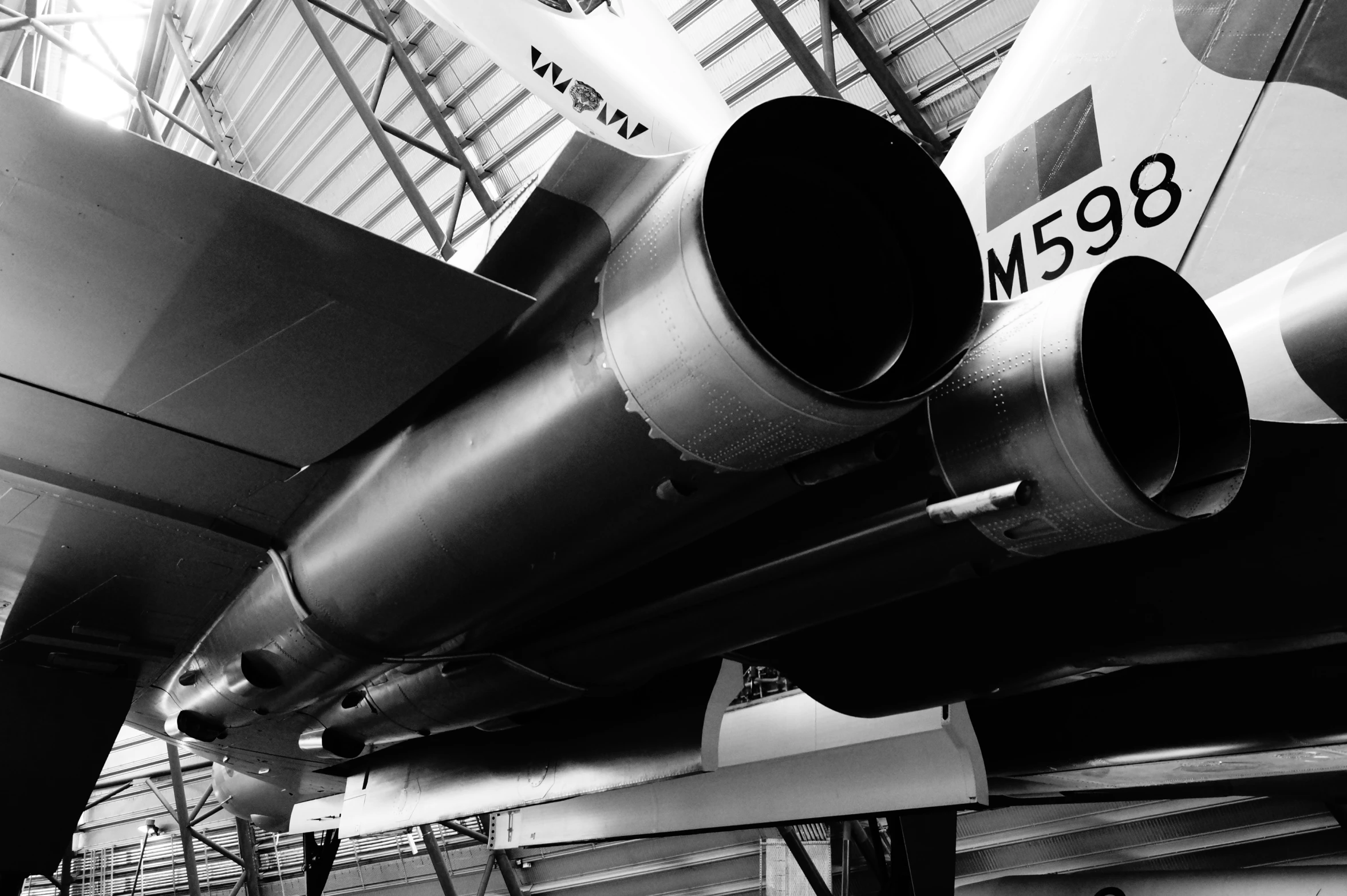 an airplane is sitting in an indoor facility