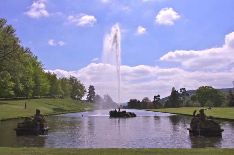 large body of water with water spouting out of the sides