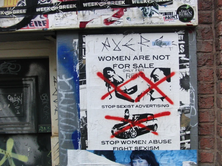 graffiti on an old building says women are not for sale stop sex sex advertising