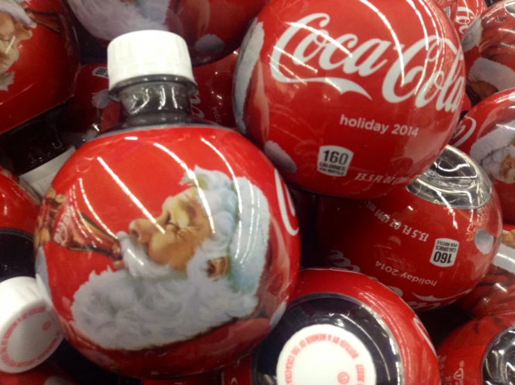 coca - cola christmas ornaments with a santa clause on them