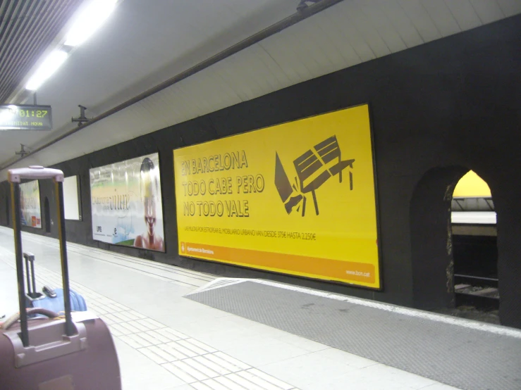 yellow and black poster advertises the train station