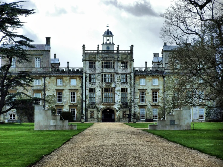 an ornate mansion with a walkway leading to it