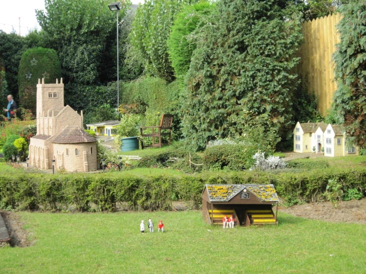 a scenic model of a house, gardens and a church