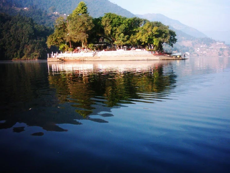 the large boat is docked at the shore