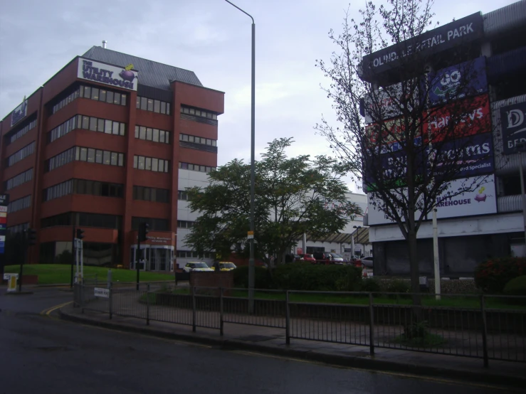 an empty street is next to a large building