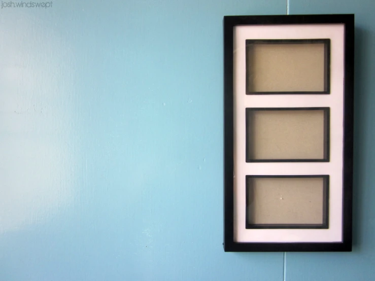 the reflection in the black frame is of another mirror