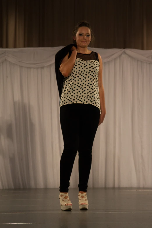 a person on a catwalk on a stage