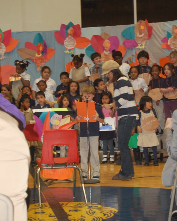 a group of s standing around each other near a crowd