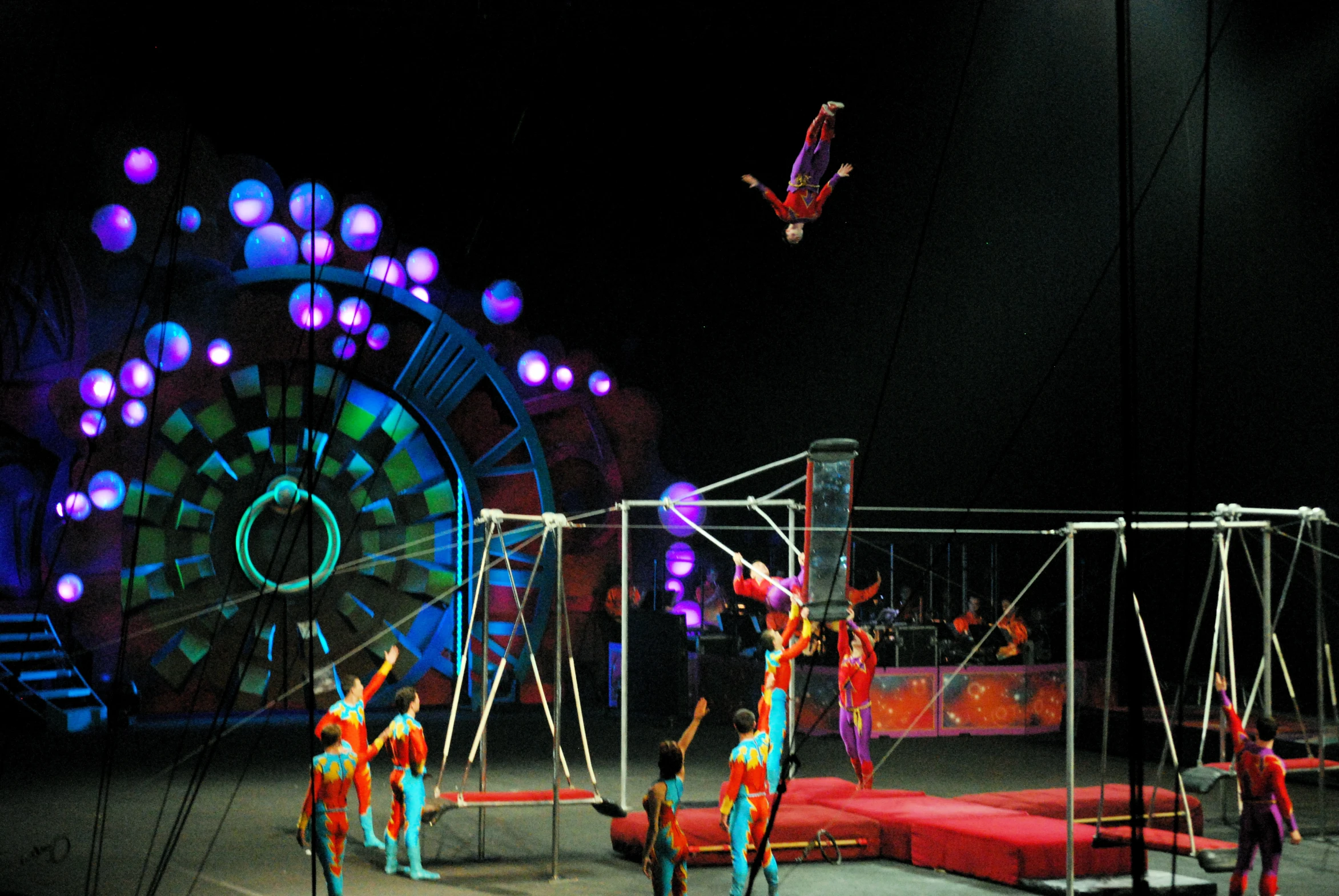 circus performers are performing tricks on the ring