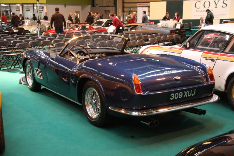 a car is parked in a show room