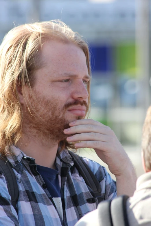 a close up of a person with a beard