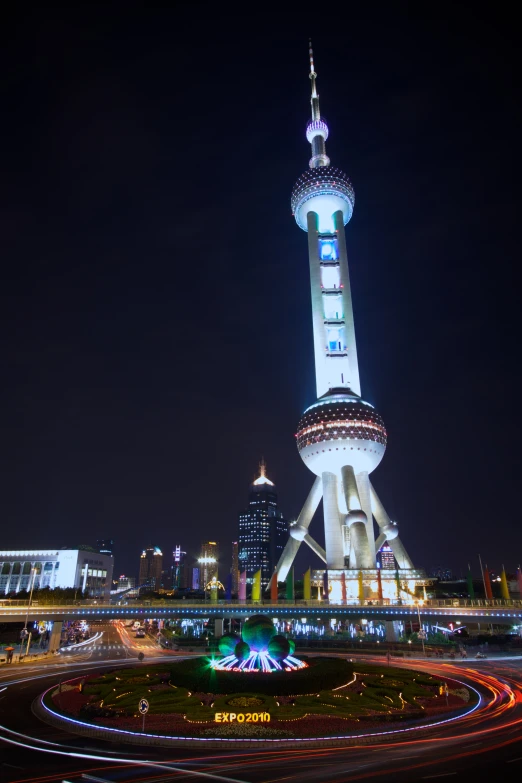 light trails across a city at night in a circular display