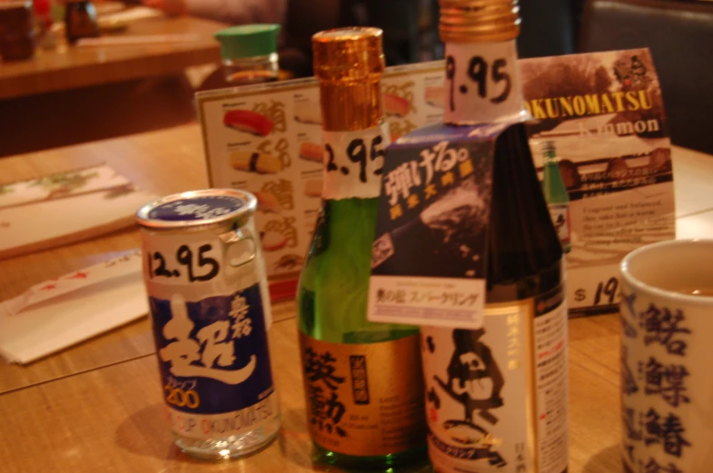 a close up of an assortment of bottles on a table