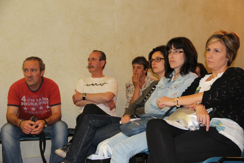 a group of people sitting in a waiting area