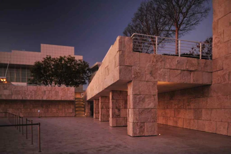 large stone structure at night with stairs and railing