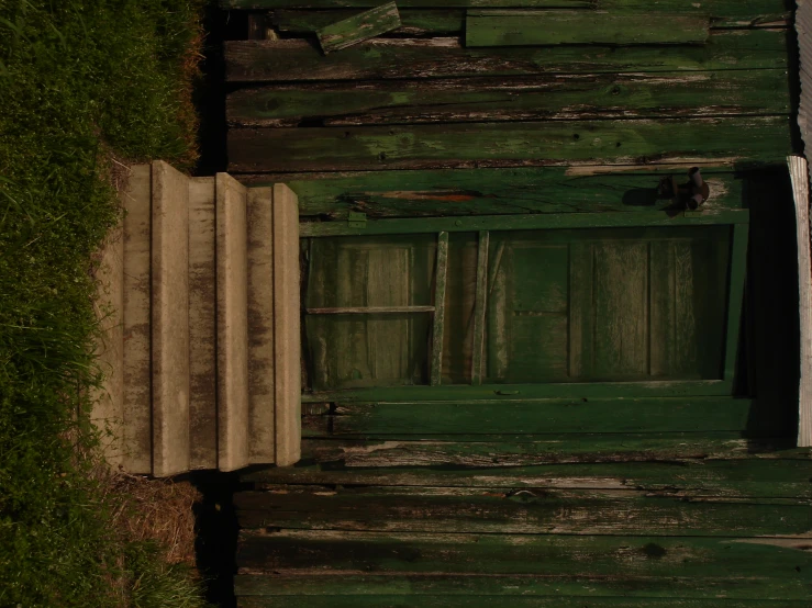 there is an old door in a wooden building