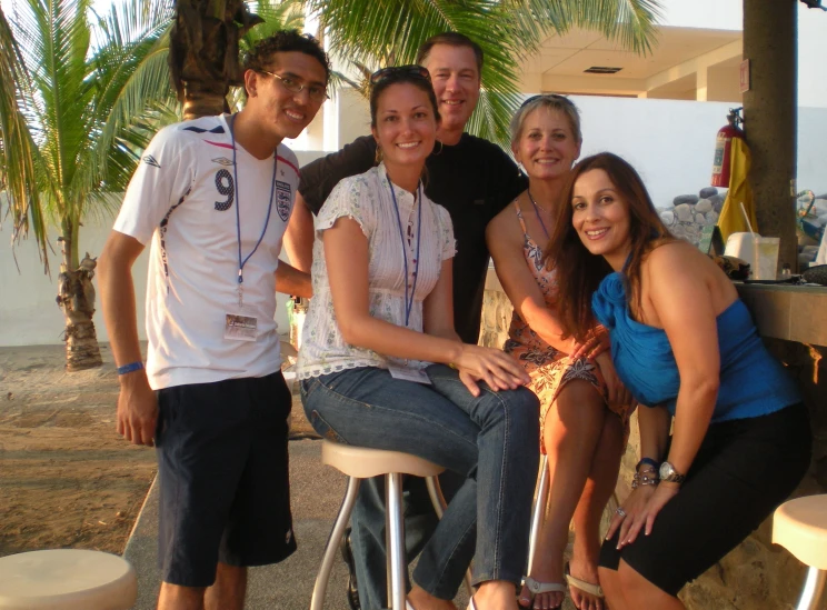 a group of people are posing for the camera