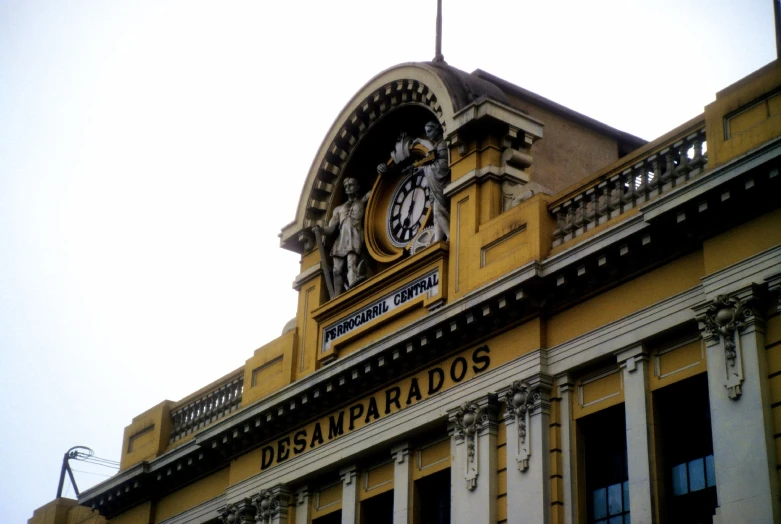 the clock on the building is located near the street