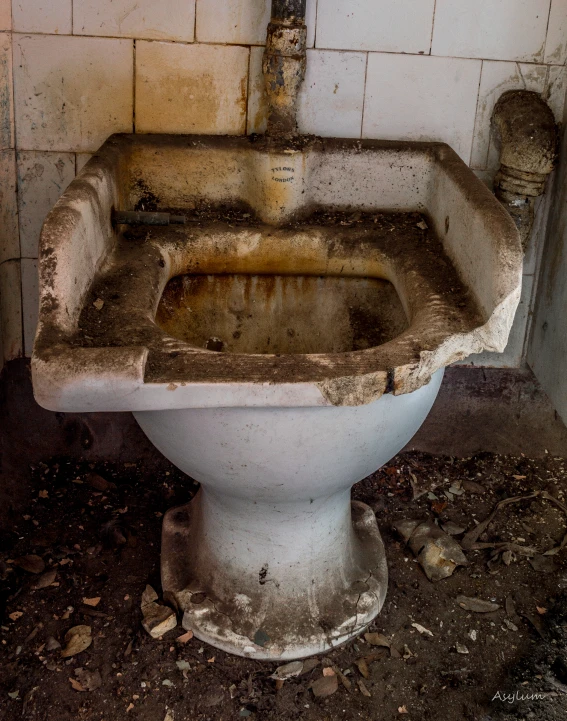 a toilet that has been abandoned and is on its side