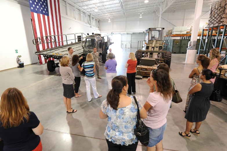 a group of people looking at an exhibit