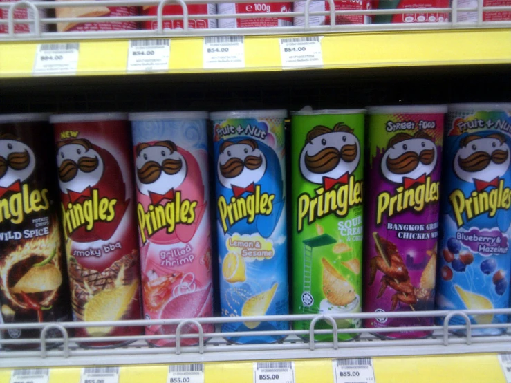 a row of pringles sitting next to each other in a store
