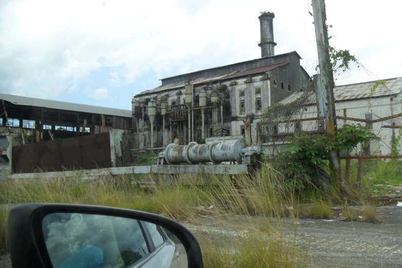 a side car view shows the old buildings and grass