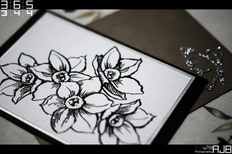an artistic card with flowers that look like the same