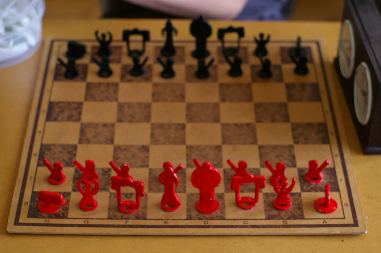a chess board with plastic figures on top of it